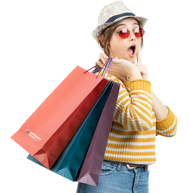 Woman wearing sunglasses holding shopping bags