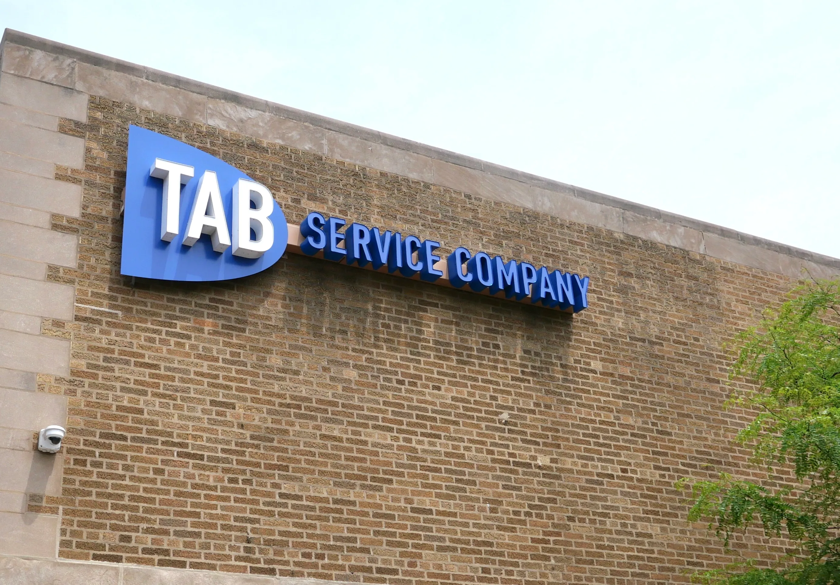 Close-up of the TAB Service Company sign